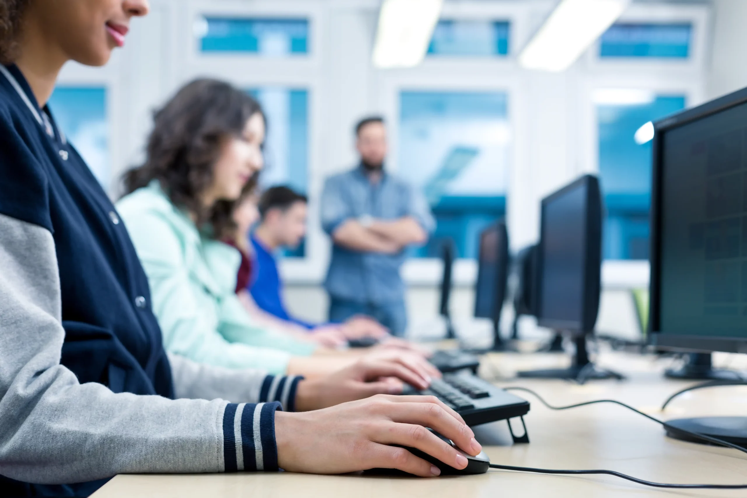 kcopycropped picture of students using computers in a classroom
