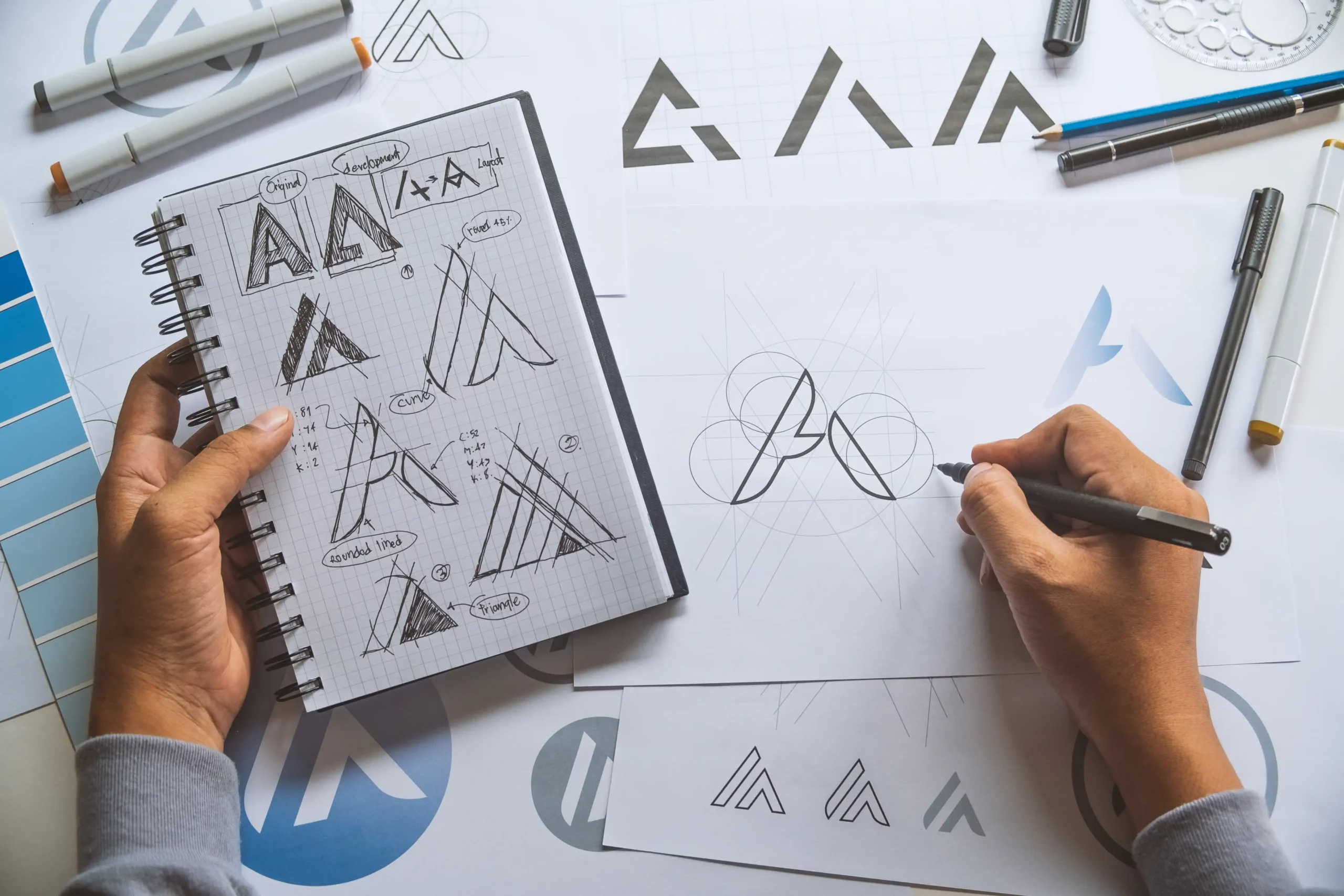 kcopygraphic designer development process drawing sketch design creative ideas draft logo product trademark label brand artwork. graphic designer studio concept.