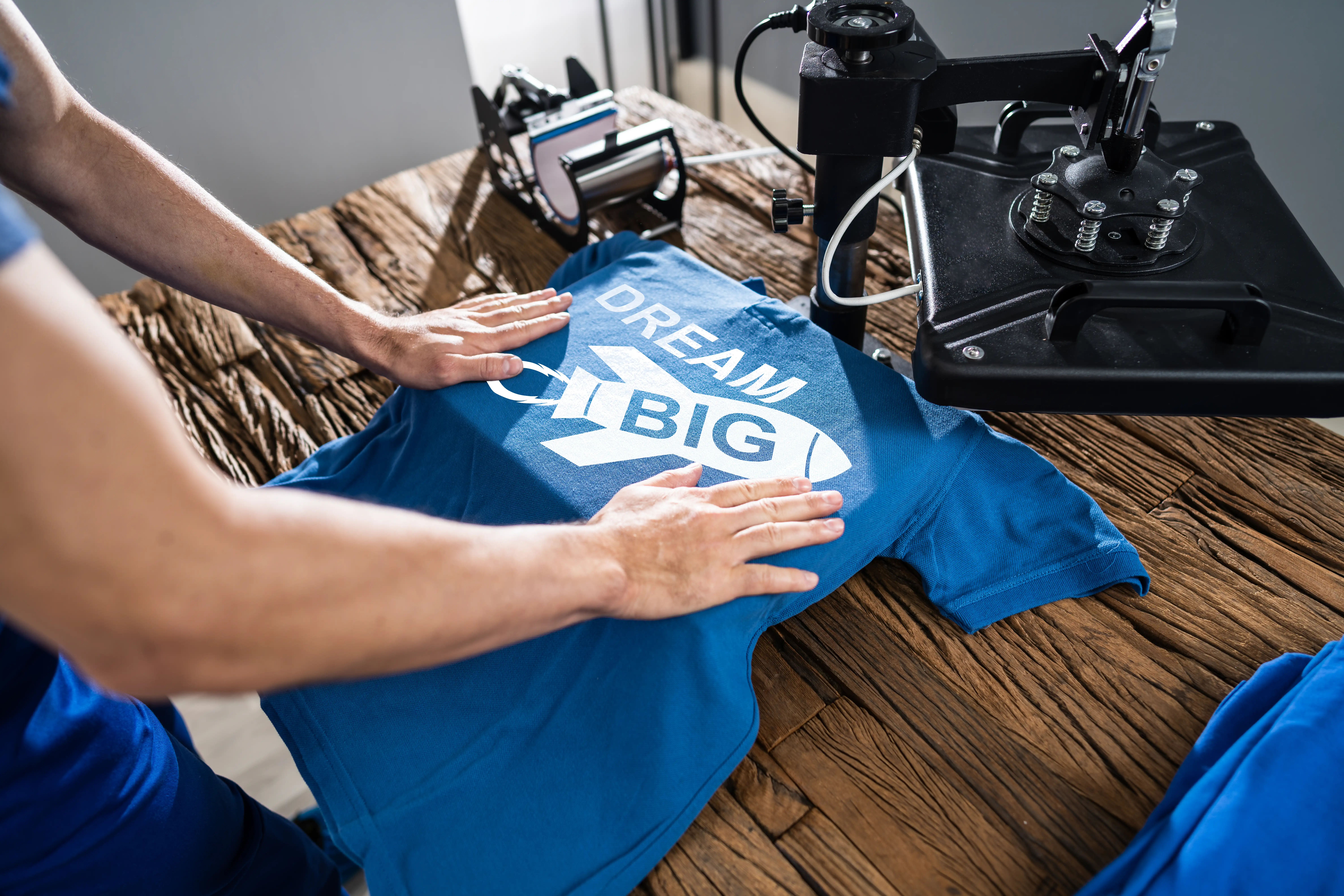 kcopyman printing on t shirt in workshop